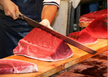 Cutting tuna fish.